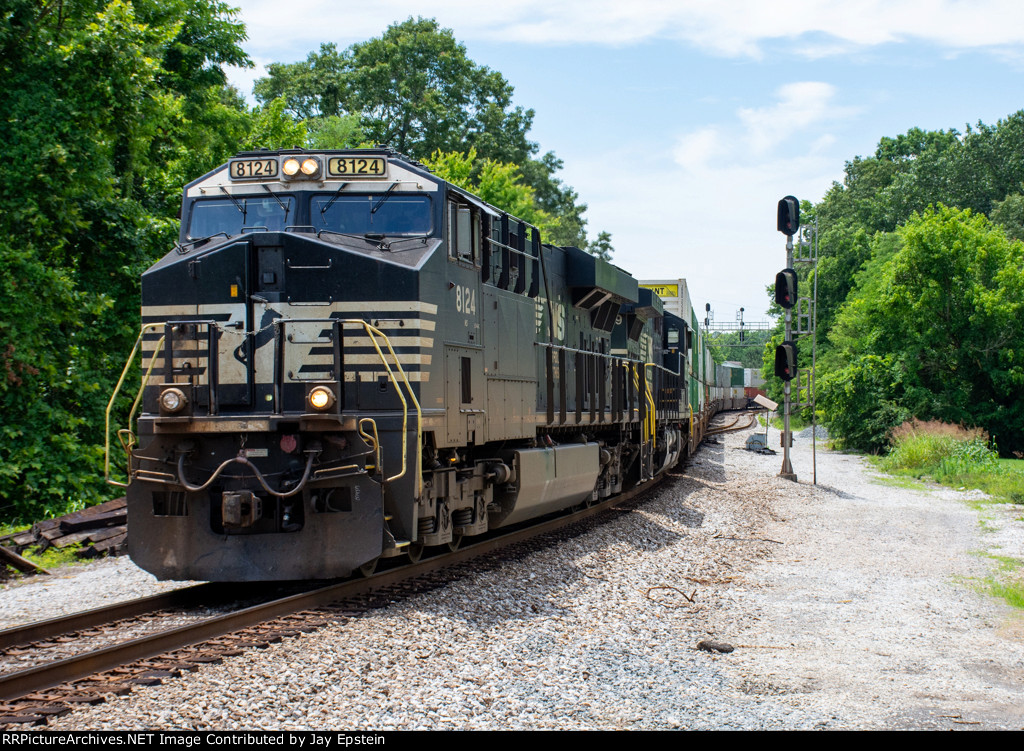 NS 8124 leads an intermodal onto the single track 